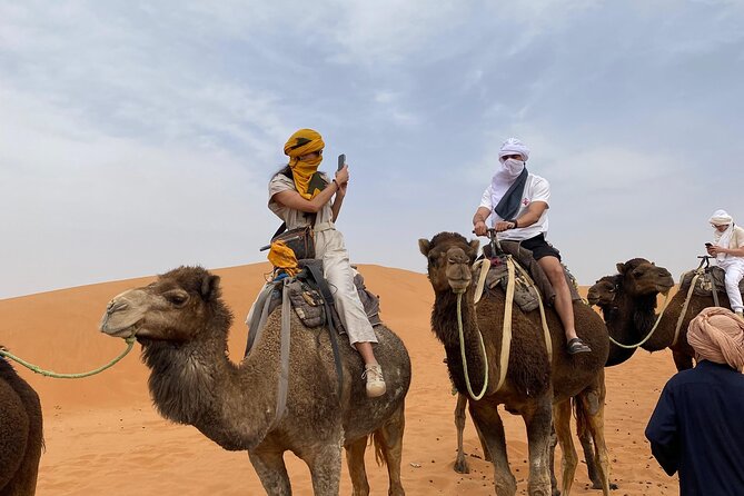3-Day Marrakech to Merzouga Desert Experience and Camel Trekking - Melaab Berber family shop: practical souvenirs and a quick outfit moment