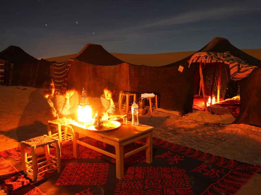 Agafay desert Dinner experience with sunset views & Swiming - Entering the Bedouin Tent: Candlelight, Campfire, and Live Music