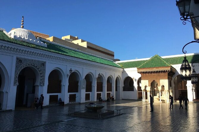 Fez Medina 4-Hour Guided Walking Tour - The Medina Streets Stop: Spices, Carpets, and How to Browse Smart