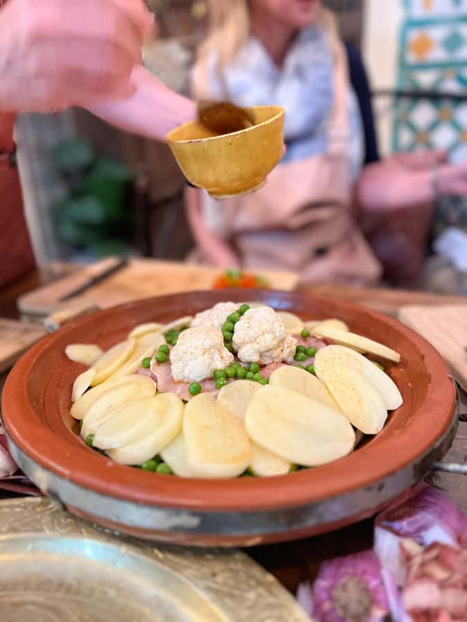 Fez: Souk Tour and Traditional Home Cooking Class - Cooking in the family home: tagine, pastilla, and spice technique