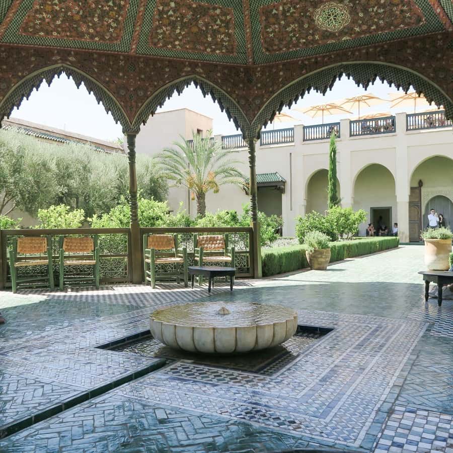 From Casablanca: Marrakech Guided Day Trip with Camel Ride - Bahia Palace: Gardens, Tilework, and a Small Entry Fee Detail