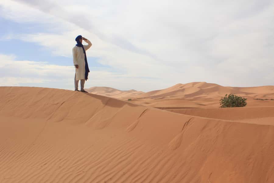 From Merzouga: Sunset Camel Ride & Sandboarding - Your Camel Guide and Photo Moment: From Scenic to Personal