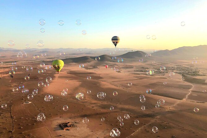 Hot air balloon flight at sunrise in Marrakech & breakfast - Meeting at Dawn: Pickup, Mint Tea, and Balloon Setup