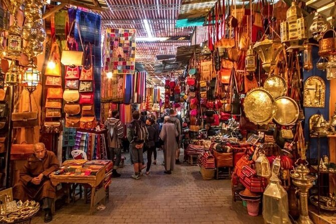 Marrakech City Highlights Half Day Private Tour - Jemaa el-Fnaa: souks, rooftop tea, orange juice, and street performance