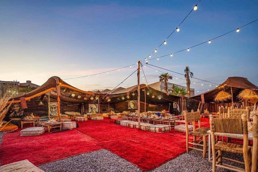 Marrakech: Dinner in Agfay Desert, Camel Ride & Fire Show - Dinner in a nomad tent: tagine, couscous, and setting expectations