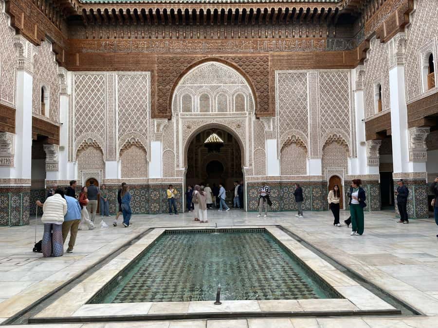 Marrakech: Madrasa Ben Youssef, Secret Garden & Medina Tour - Café Argana meeting point and the walking rhythm that works