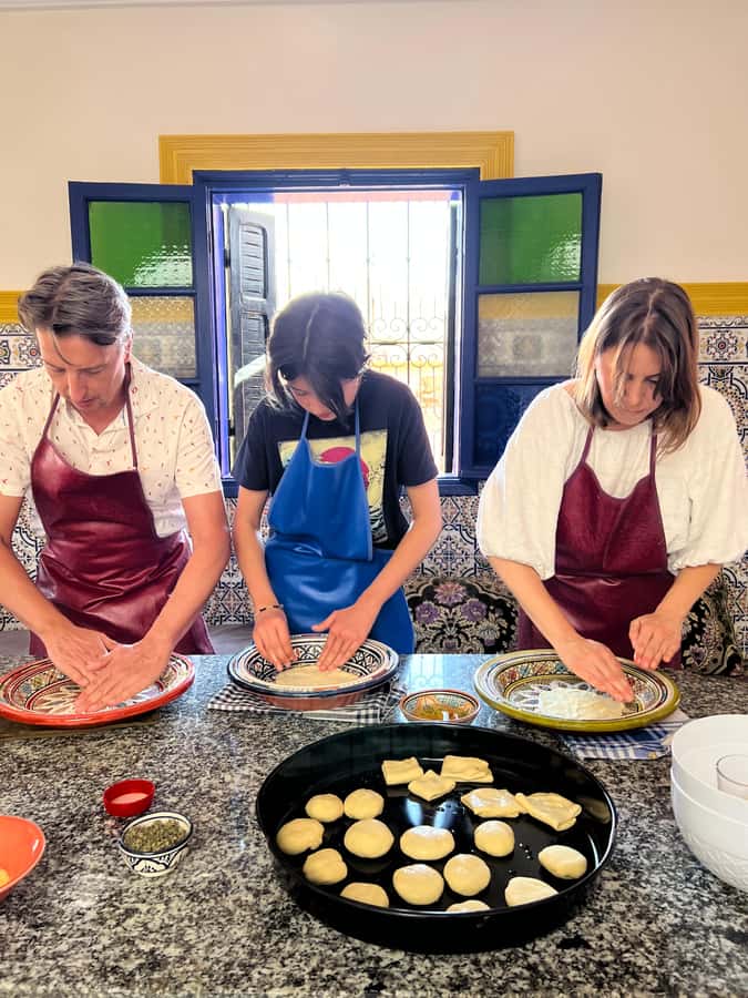Marrakech: Traditional Moroccan Crepes & Bread Cooking Class - Inside the workshop: aprons, tools, and a very workable plan
