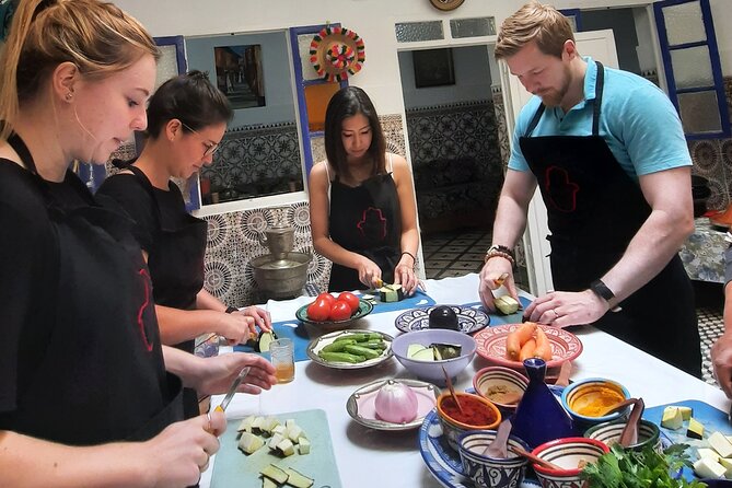 Moroccan Cooking Class & Marrakech Market Visit with Chef Khmisa - How the cooking class actually runs: team stations and spice technique
