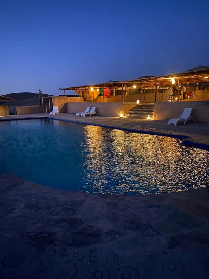 Overnight Agafay Desert Camel Ride Dinner show & Sunset - Dinner under the stars: tagine, couscous, and a show