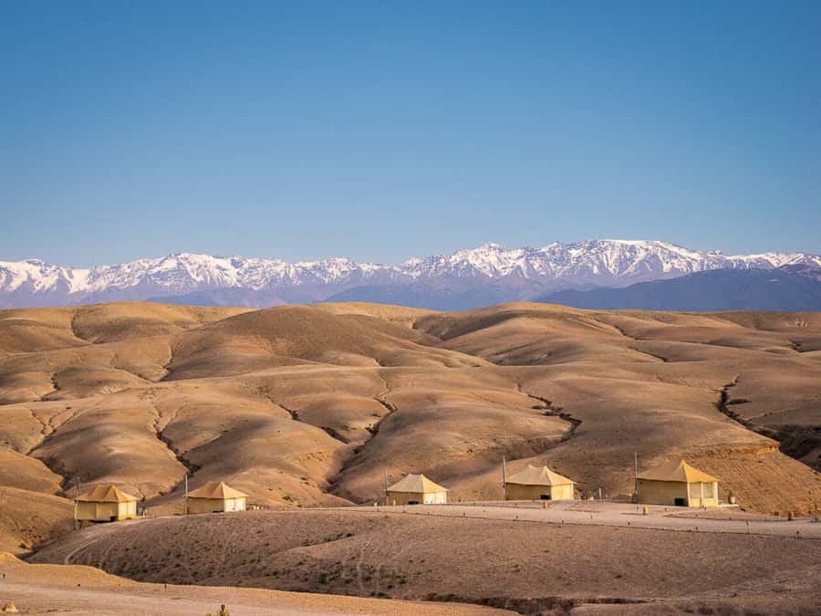 Romantic Dinner & Camel Ride In Agafay Desert - Leaving Marrakech for Agafay: Atlas views and Lake Lalla Takerkoust on the way