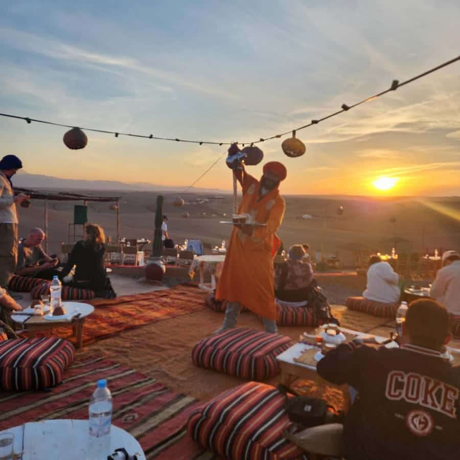 Unforgettable Desert Night: Dinner, Camel Ride & Quad Bike - Agafay sunset views, tea, and campfire energy
