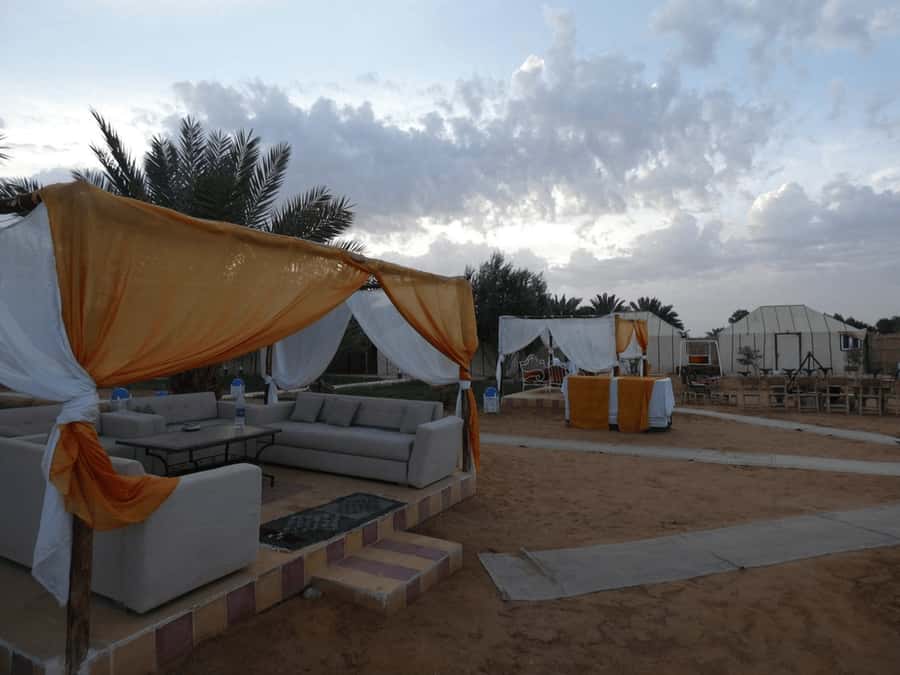 Unique 2 Days Fez Marrakech via Desert & Visit Ait Benhaddou - Arriving at Merzouga: Erg Chebbi dunes and a camp on the edge